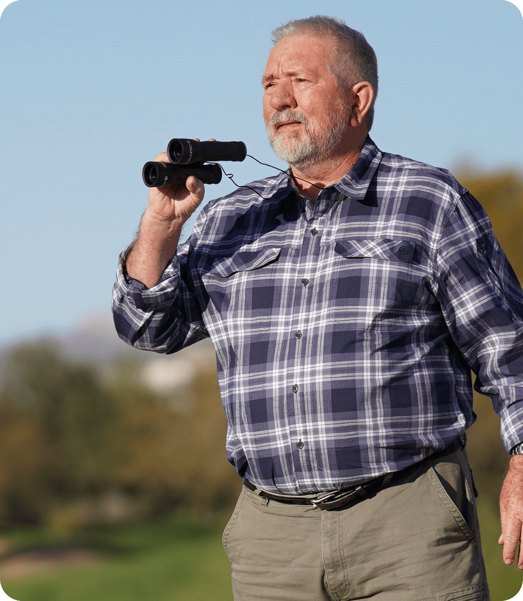Acthar Gel patient: Gary outdoors with binoculars